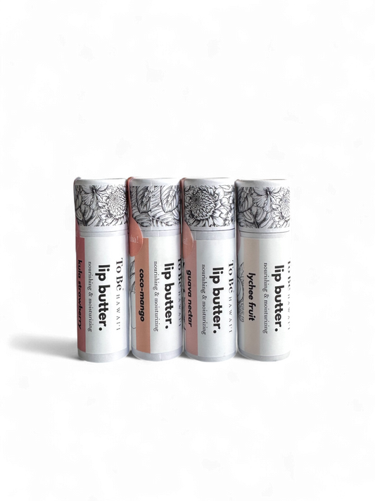 Four lip butter tubes on a white background