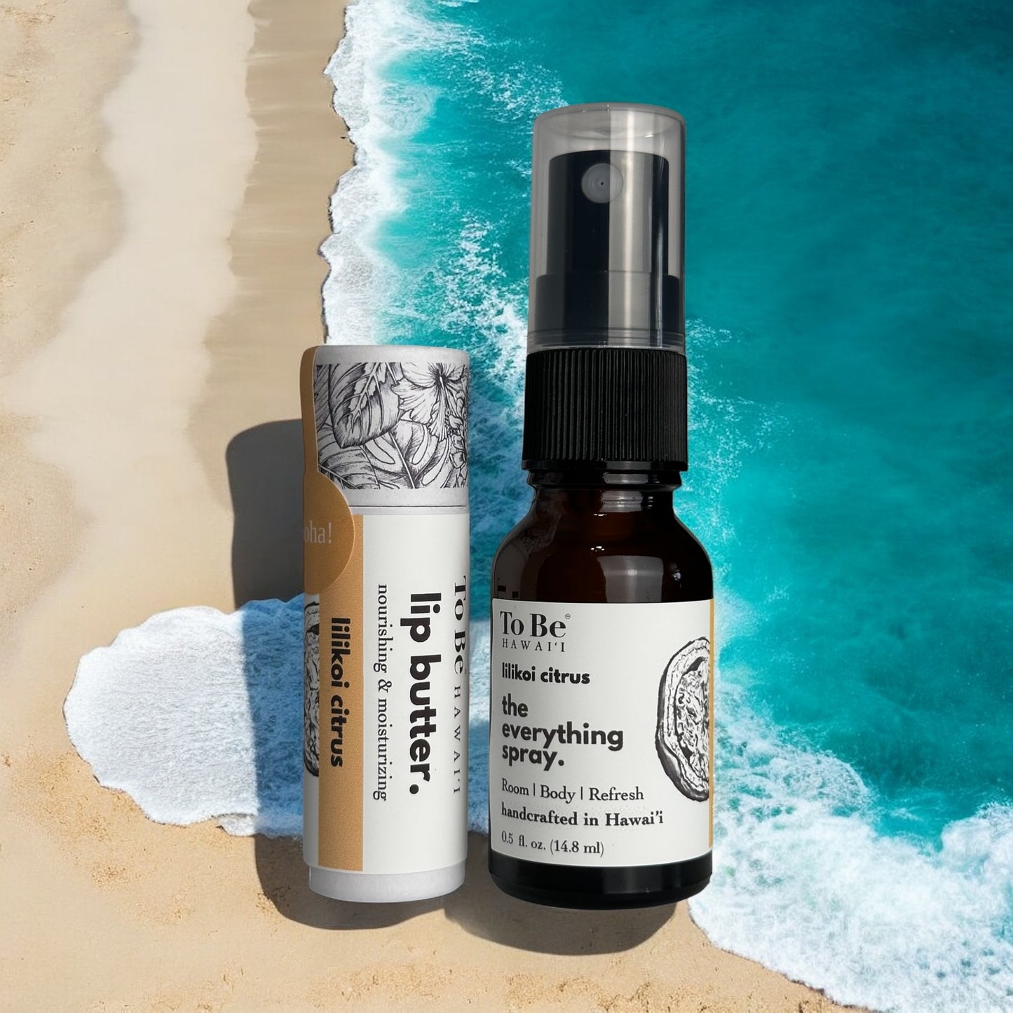 Two products, a lip butter and a spray bottle, on a beach with ocean waves in the background.