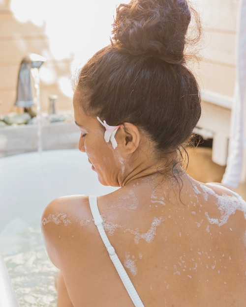 woman in a bath tub with bubbles
