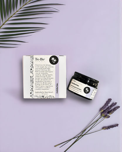 Jar of 'To Be' skincare product with packaging and lavender flowers on a light purple background