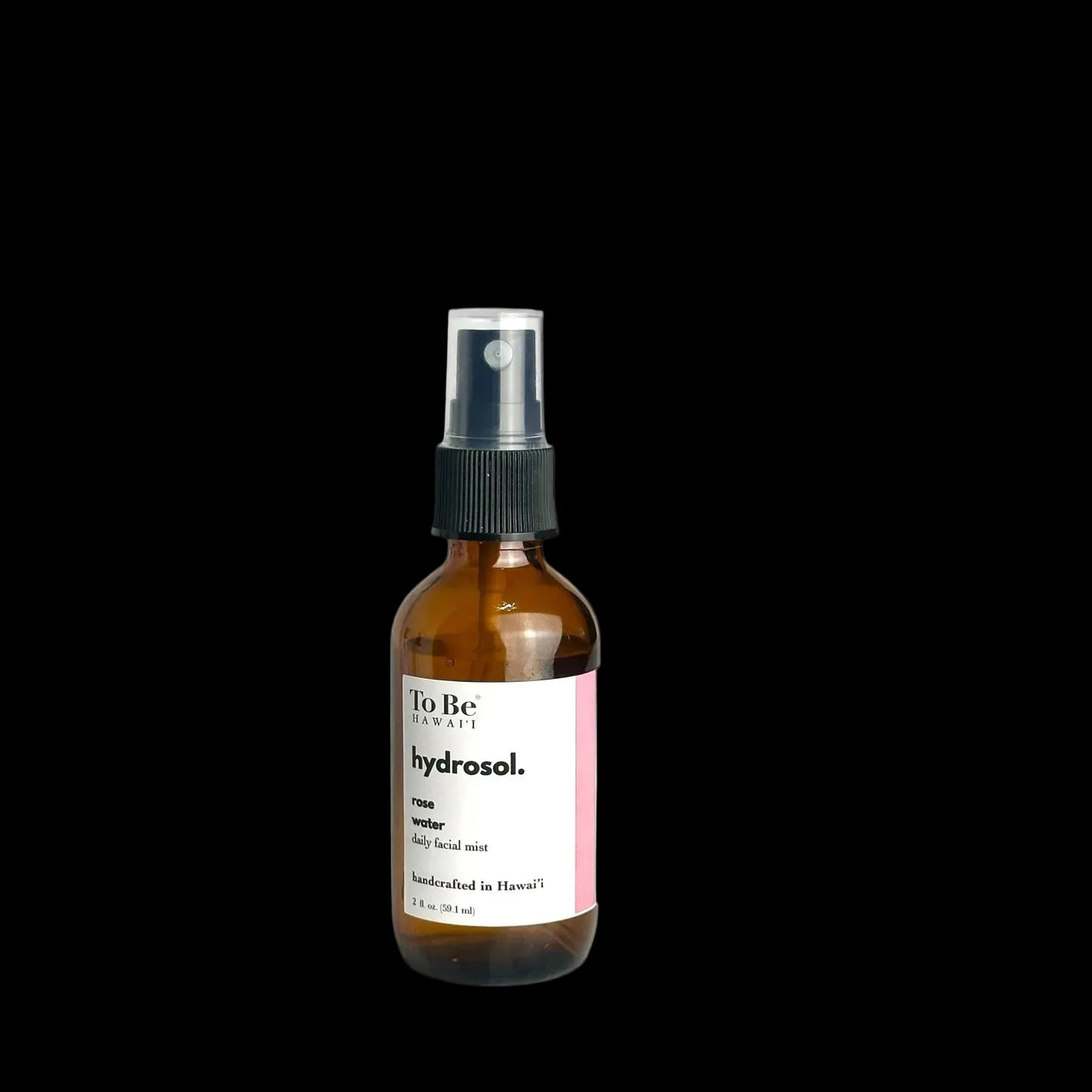 A brown bottle with a spray nozzle containing rose hydrosol, labeled 'To Be Hydrosol. 100% Rose water. Distilled in Hawaii'.