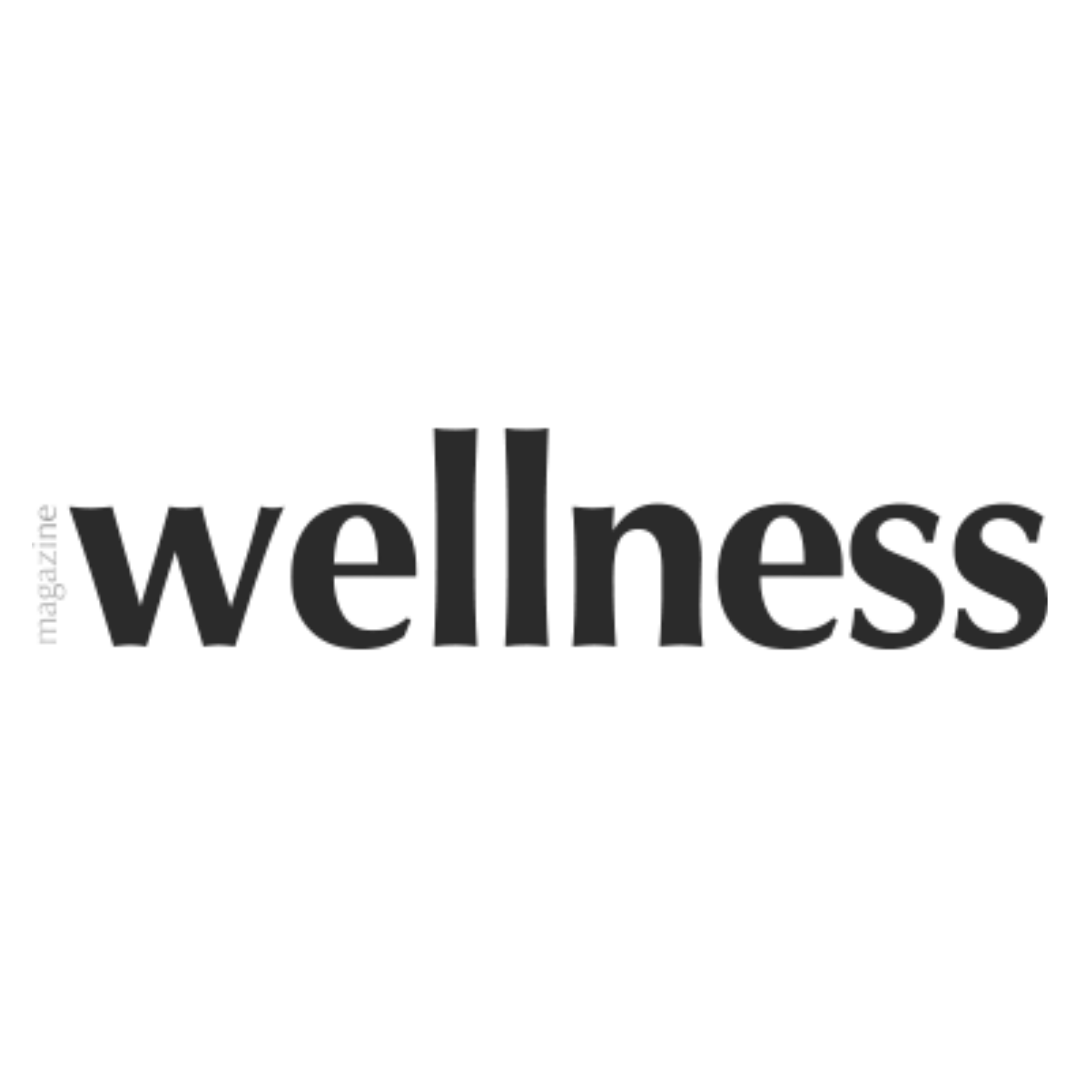 Logo of 'wellness magazine' with black text on a white background